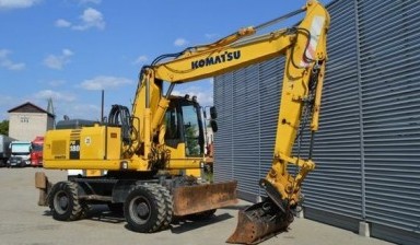 Аренда экскаватора с гидробуром от ГорСпецТранс: Komatsu 1 фото