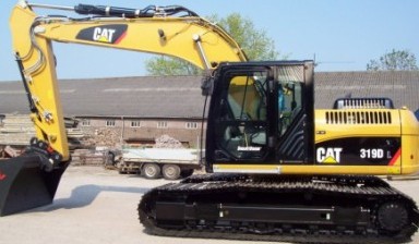 Аренда экскаватора с грейдерным отвалом от Спецтехника: Caterpillar 1 фото