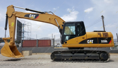 Аренда автомобильного экскаватора от Максим: Caterpillar 1 фото