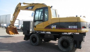 Аренда экскаватора с гидромолотом от ТКК: Caterpillar 1 фото