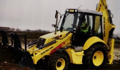 Аренда экскаватора-погрузчика с планировочным ковшом от ТОРГМЭТР: NEW HOLLAND 1 фото