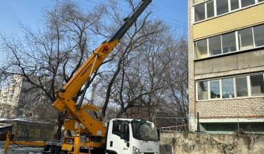 Услуги колесной автовышки от СпецТехСтройДв: ISUZU ELF 4 фото